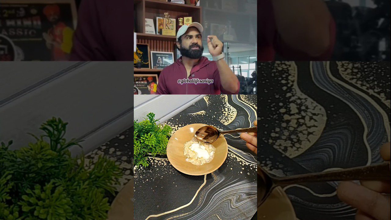 Vyras kalba virš stalo, ant kurio dubenėlyje šaukštu dedamas jogurtas su druska ir žolelėmis