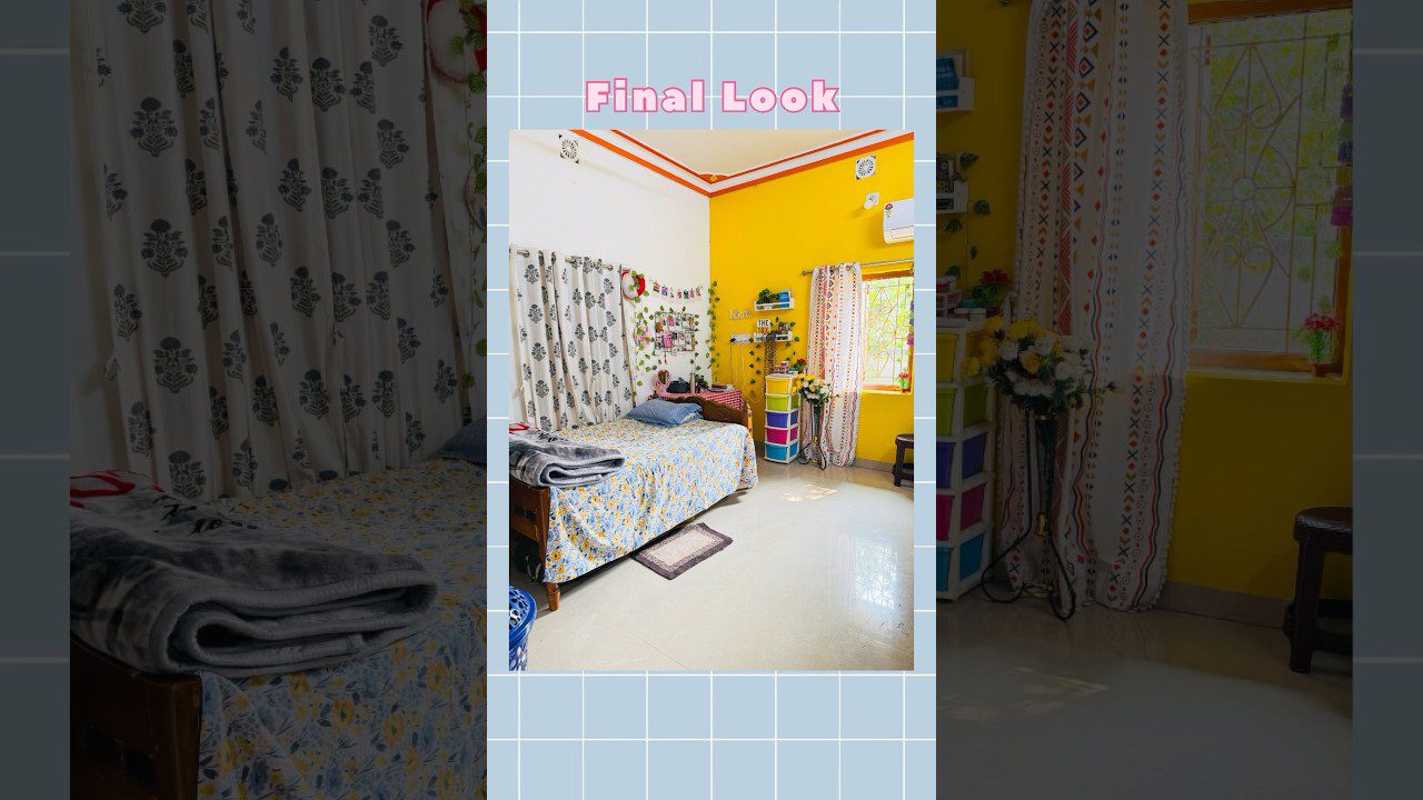 Geltonai dažytas kambarys su viengule lova, gėlėmis ir spalvotomis lentynomis