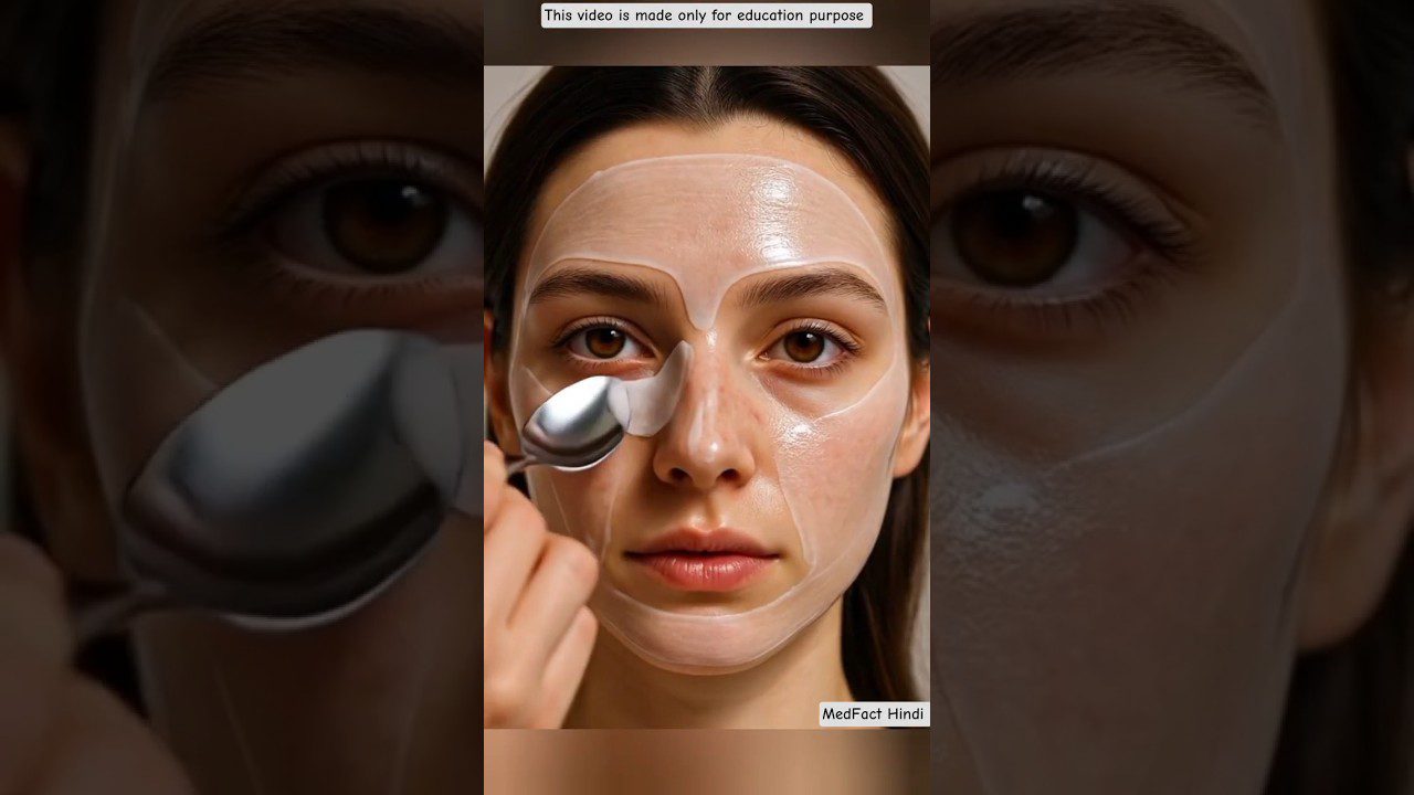 Jaunos moters veidas su skaidria odos kauke ir metaliniu šaukšteliu po akimi, tekstas: tik mokymuisi.