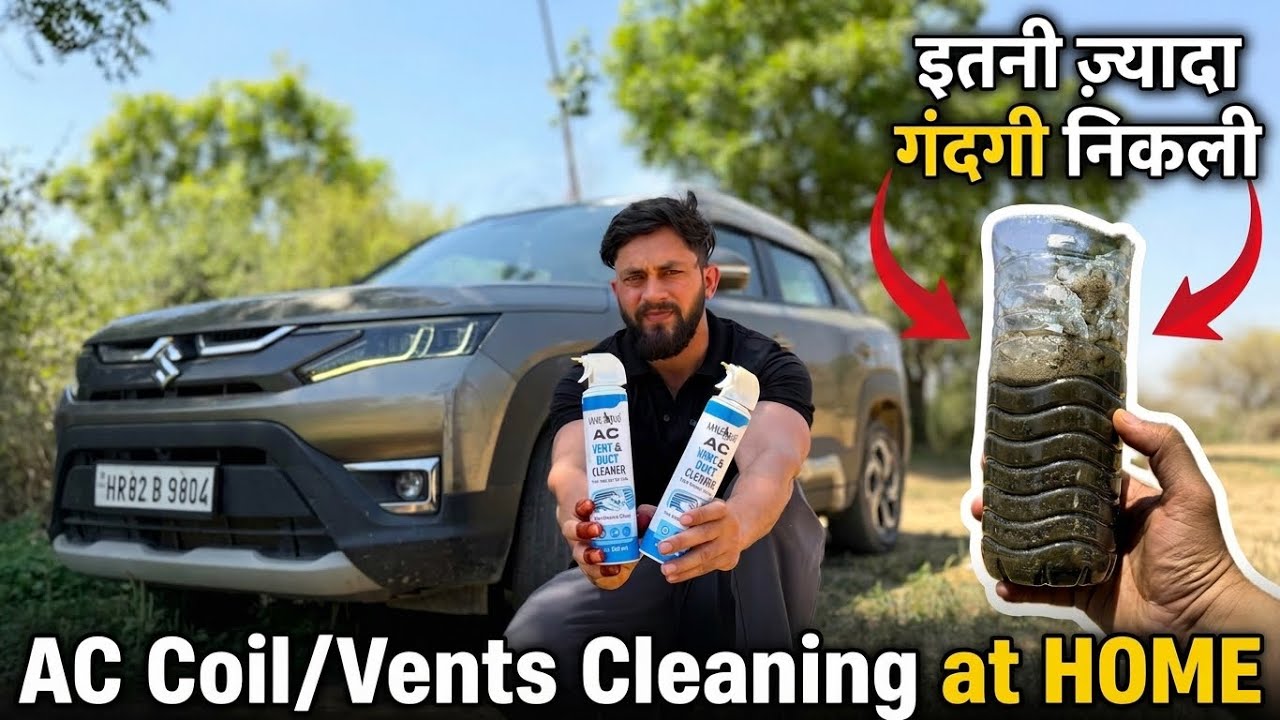 Vyras lauke laiko automobilių oro kondicionieriaus valiklius prieš SUV ir purvino butelio turinį.