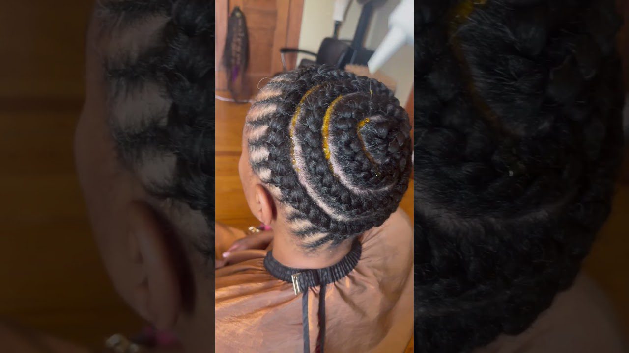 Moters galvos kirpčiukai supinti spirale į aukštą kasą, su auksinėmis detalėmis